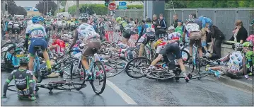  ?? — THE ASSOCIATED PRESS ?? Riders crash during the fifth stage of the Tour de France cycling race between Arras and Amiens, France, Wednesday.