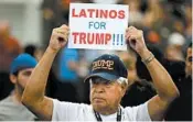  ?? JAE C. HONG/AP 2016 ?? A man holds up a sign for then presidenti­al candidate Donald Trump in Anaheim, Calif.