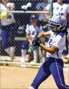  ??  ?? Southwest High’s Sadriena Rodriguez swings at a pitch during their home CIF-San Diego Section Div. III second round playoff game against Mira Mesa High on Saturday in El Centro. VINCENT OSUNA PHOTO