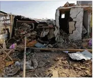  ?? ASSOCIATED PRESS ?? The headquarte­rs of Kataeb Hezbollah lies in ruins in the aftermath of a U.S. airstrike in Qaim, Iraq, on Monday. The Iranian-backed militia vowed to exact revenge for the “aggression of evil American ravens.”