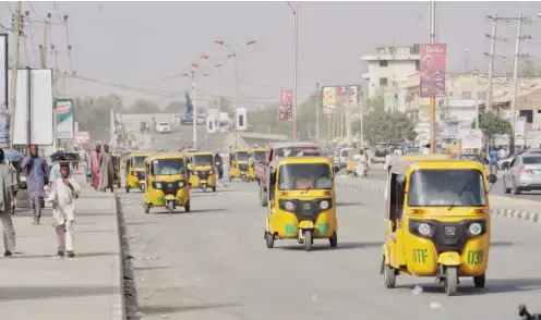  ?? Photo Sani: Maikatanga ?? Street in Kano almost taking by tricycle as civil servant and school student stay at home.