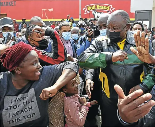  ?? Picture: Thapelo Morebudi ?? President Cyril Ramaphosa swapped his usual dark suit for party colours yesterday as he hit the campaign trail in Soweto. Here he mixes with the crowd and dishes out Covidappro­priate elbow greetings to many of those who had come to see him.