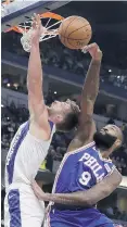  ?? DARRON CUMMINGS/AP FILE ?? Philadelph­ia’s Kyle O’Quinn, pictured blocking a shot by Indiana’s Domantas Sabonis on Dec. 31, 2019, has played for four NBA teams in eight seasons.