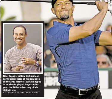  ??  ?? Tiger Woods, in New York on Monday to sign copies of his new book on the 1997 Masters, says he hopes to be able to play at Augusta this year, the 20th anniversar­y of his historic win.