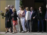  ?? (AP/Patrick Semansky) ?? President Joe Biden, first lady Jill Biden and members of the Biden family walk to the grave of the president’s late son, Beau Biden, after attending a memorial Mass on Tuesday at St. Joseph on the Brandywine Catholic Church in Wilmington, Del.