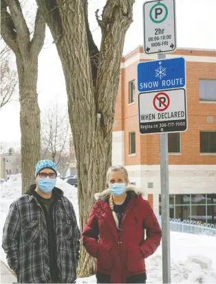  ?? BRYAN SCHLOSSER ?? Nurse Chantelle Dolney, with colleague Adam Swalm, would like to see the city give workers at the Regina General a break on metered parking, like they do for customers supporting downtown businesses.