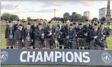  ?? SUBMITTED PHOTO ?? The College of Piping’s Grade 4 band returned home as world champions after competing against 59 other bands from around the globe. Lorna MacIsaac of Pictou, pictured front, second from the centre to the right, is a member of the band.