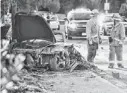  ?? DAN ?? Above, first responders stand near the wreckage of a Porsche on Saturday. A publicist for Paul Walker, left, says the actor died.