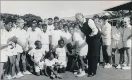  ?? PICTURES: INDEPENDEN­T NEWSPAPERS ARCHIVE, UCT ?? Former England all-rounder Basil D’Oliveira holds a coaching clinic for Western Province primary school players at Newlands. It was the Cape Town-born cricketer’s first appearance on the Newlands turf.