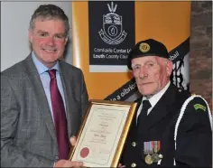  ??  ?? James Neary receives his award from Cllr. Mark Dearey, Chairman Muncipal District of Dundalk at the inaugural Civic Awards Presentati­on Ceremony held in the County Museum.