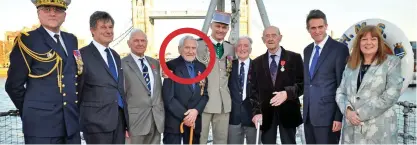  ??  ?? Brave: John Nicholls, circled, with fellow veterans, the French ambassador and Gavin Williamson