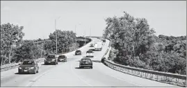  ?? DAILY SOUTHTOWN ?? Cars travel on the Route 7 bridge over the Des Plaines River into downtown Lockport. A study shows Will County grew by 7,207 residents over the past decade.
