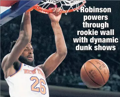  ?? AP ?? SLAM DANCE: Mitchell Robinson powers the ball through on a dunk during a recent game. The Knicks rookie has been on fire, averaging 12.3 points and 2.5 blocks in his past four games heading into Wednesday vs. the 76ers.