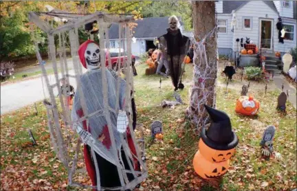  ?? JONATHAN TRESSLER — THE NEWS-HERALD ?? A view of some of the characters adorning the Heath household’s home on South Ridge Road in Madison Township in honor of the family’s love for all things Halloween.