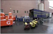  ?? YOUNG KWAK — THE ASSOCIATED PRESS ?? Cal team staff members load equipment onto the team’s trailer outside Martin Stadium after Saturday’s game against Washington State was canceled because of a case of COVID- 19 on the Cal team.