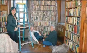  ?? News-herald photos — DEBBY HIGH ?? Pearl S. Buck House curator Donna Rhodes and volunteers Susie Woodland and Becky Kiefer work in the library.