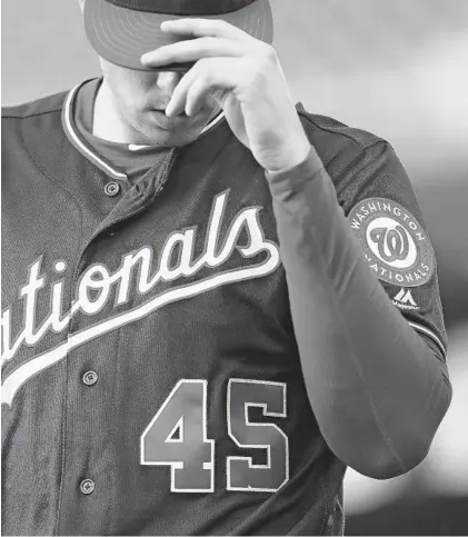  ?? PATRICK SMITH/GETTY ?? Nationals pitcher Patrick Corbin, honoring Tyler Skaggs by wearning No. 45, said Tuesday: “He’s just all I’m thinking about.”