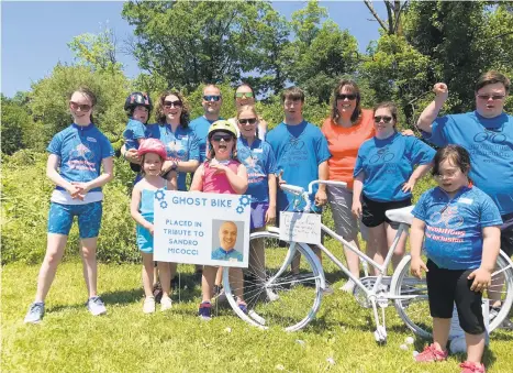  ?? KEVIN DUFFY/SPECIAL TO THE MORNING CALL ?? Organizers and participan­ts gather Saturday for the Revolution­s for Inclusions bike ride put on by the Eastern Pennsylvan­ia Down Syndrome Center at Slatington Airport.