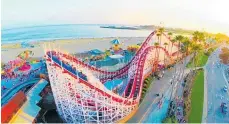  ?? Photos / Visit Santa Cruz County / Dave Nelson Liquid Imagery ?? From left, Santa Cruz's Giant Dipper rollercoas­ter is pure oldschool Americana; surfing is huge in Santa Cruz.