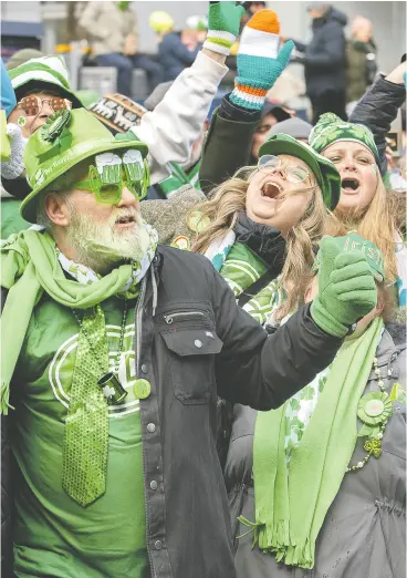  ?? GRAHAM HUGHES / THE CANADIAN PRESS FILES ?? Revellers celebrate St. Patrick’s Day in Montreal last year.