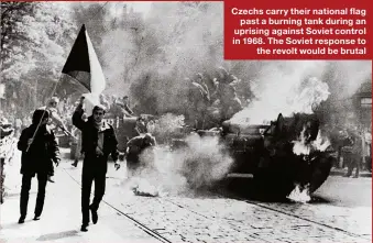  ??  ?? Czechs carry their national flag past a burning tank during an uprising against Soviet control in 1968. The Soviet response to the revolt would be brutal