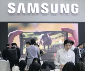  ?? PHOTO: AP ?? Visitors experience Samsung Electronic­s’ Galaxy Note 8 smartphone­s during the 2017 Korea Electronic­s Grand Fairs in Seoul, South Korea, yesterday. The environmen­tal group Greenpeace issued a report yesterday giving technology titans such as Samsung, Amazon and Huawei low marks for their impact on the environmen­t.