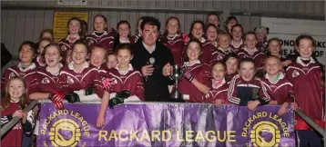  ??  ?? Caoimhe Jordan of Bunclody is presented with the cup by Jim Dempsey of the Rackard League.