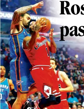  ?? AP ?? CHICAGO Bulls’ Derrick Rose goes for a shot off Oklahoma City Thunder’s Steven Adams during first half action.