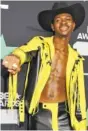  ?? PHOTO BY RICHARD SHOTWELL/INVISION ?? Lil Nas X poses in the press room at the BET Awards in June.