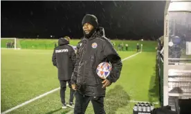  ?? Photograph: Gary Calton/The Guardian ?? Pascal Chimbonda on the touchline during Skelmersda­le’s 3-1 defeat by Kendal in the rain on Wednesday.