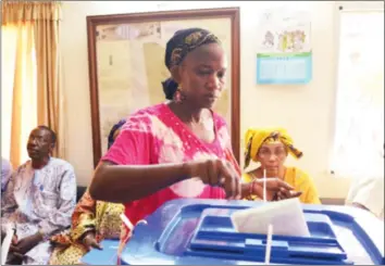  ??  ?? A woman casts her vote in the Malian election runoff yesterday