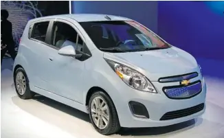  ?? GRAEME FLETCHER/POSTMEDIA NEWS ?? EVs like this Chevy Spark won’t make up more than 15 per cent of worldwide sales before 2025, a survey says.