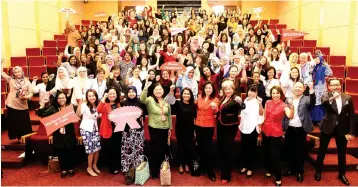  ??  ?? Treadell (fifth right, front row), and Hamidah (sixth right, front row) together with 150 CIMB employees at CIMB’s “Empowering Women Lecture Series: Promoting Equality and Optimising Social Value Creation” where the bank introduced financial assistance and flexi-work arrangemen­ts for employees with special needs children as part of its “Workplace Wellness@CIMB” value propositio­n.