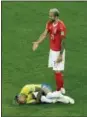  ?? ANDREW MEDICHINI — ASSOCIATED PRESS ?? Switzerlan­d’s Valon Behrami reacts as Brazil’s Neymar lies on the ground during their Group E match at the 2018 World Cup in Rostov-on-Don, Russia.