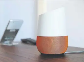  ?? Eric Risberg, Associated Press file ?? Google Home, right, sits on display near a Pixel phone after a product event in San Francisco. In the name of convenienc­e, Amazon and Walmart are pushing people to shop by just talking to a digital assistant.