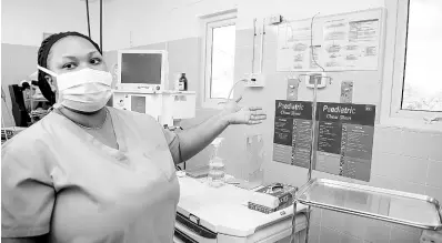  ?? ?? Registered nurse Shanice Brown shows a section of a ward at the Savanna-la-Mar Public General Hospital.