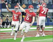  ?? ASSOCIATED PRESS] [TONY GUTIERREZ/THE ?? Oklahoma quarterbac­k Baker Mayfield (6) and wide receiver Marquise Brown (5) celebrate a touchdown in the second half of the Big 12 Conference championsh­ip game against TCU on Saturday in Arlington, Texas.