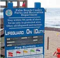  ?? JOHN MCCALL/SOUTH FLORIDA SUN SENTINEL ?? A sign warning patrons of high bacteria in the water is posted near Ocean Inlet Park in Boynton Beach. The Florida Department of Health Palm Beach County issued a health advisory after recent sampling showed bacteria levels in the water to be in the poor range.