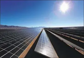  ?? Marcus Yam Los Angeles Times ?? IN THE MONTHS since California passed its 100% clean energy mandate, the idea has gained political momentum. Above, the sun rises over a solar array.