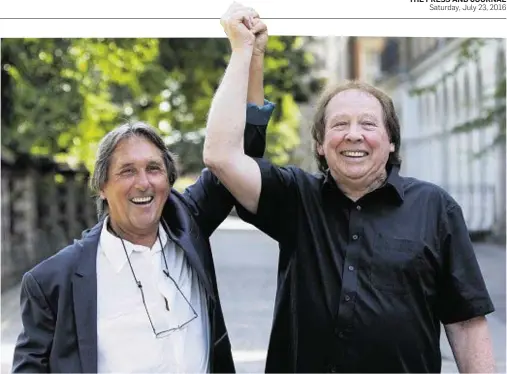  ??  ?? ACQUITTED: Leonard ‘Chip’ Hawkes, left, 70, and Richard Westwood, 73, celebrate outside Reading Crown Court yesterday