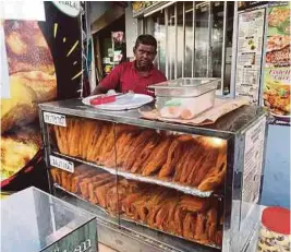  ?? ?? Kampong Gelam is filled with shops selling tasty snacks.