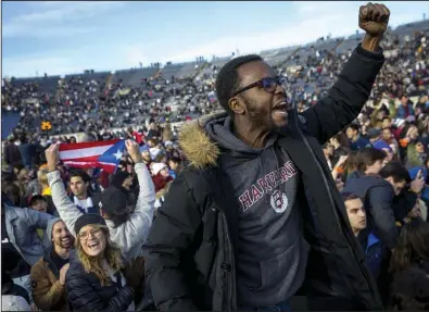  ?? (The Boston Globe/Nic Antaya) ?? In this November photo, Harvard and Yale students protest during halftime of the NCAA college football game between Harvard and Yale at the Yale Bowl in New Haven, Conn.