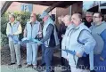  ?? / Contribute­d ?? Mike Love (center, with scissors) cuts the ribbon for the National Top 40 Radio Hall of Fame in Chattanoog­a.