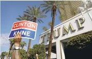  ?? JOHN LOCHER/ASSOCIATED PRESS ?? A union member holds up a sign during a rally Friday in front of the Trump Internatio­nal Hotel in Las Vegas.