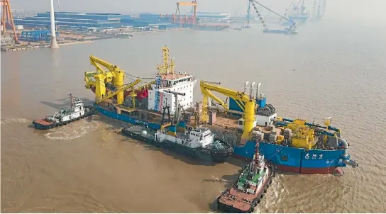  ?? PHOTO: GETTY IMAGES ?? China’s largest cutter-suction dredge Tiankun takes water on in Qidong, Jiangsu Province of China.