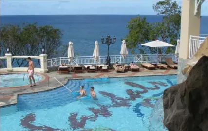  ?? PHOTO BY JOHN NOWLAN ?? Several tempting freshwater pools are spread along the Sandals La Toc resort in St. Lucia. The resort also has a sandy beach.