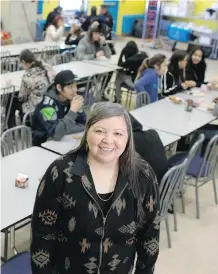  ??  ?? Kainai High School principal Annette BruisedHea­d stands in the school’s cafeteria on Wednesday where students are provided with lunch and snacks during the day. The extra nutrition is something the school feels is needed for youth on the reserve.