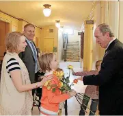  ?? [PHOTO PROVIDED BY KARA KOENIG] ?? State Rep. Kevin Calvey, R-Oklahoma City, and his family members distribute roses as part of the 2018 Rose Day activities on Wednesday at the State Capitol in Oklahoma City.