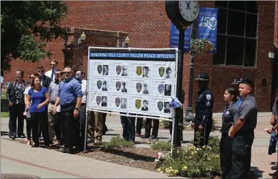  ?? CARLOS GUERRERO — DAILY DEMOCRAT ?? The Yolo County District Attorney’s office, alongside members of various county police department­s and the Yolo County Retired Peace Officers Associatio­n, met at Heritage Plazza.