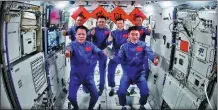  ?? XU BU / FOR CHINA DAILY ?? The three astronauts from China’s Shenzhou XVIII mission enter the country’s space station and meet with the astronauts from the Shenzhou XVII mission on Friday. The two groups of astronauts will conduct an in-orbit rotation at the space station.